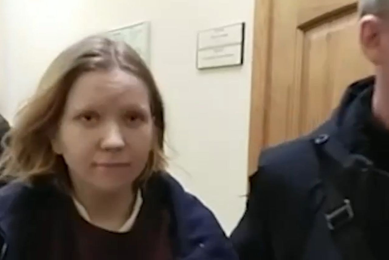 An image taken from video released by the Russian Investigative Committee on April 3, shows Darya Trepova,  walking escorted by officers inside the building of Russian Investigative Committee, in St. Petersburg, Russia.