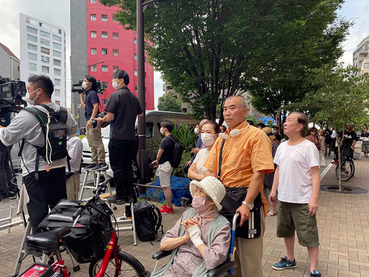 People gather near the Abe family residence in Tokyo on Saturday.