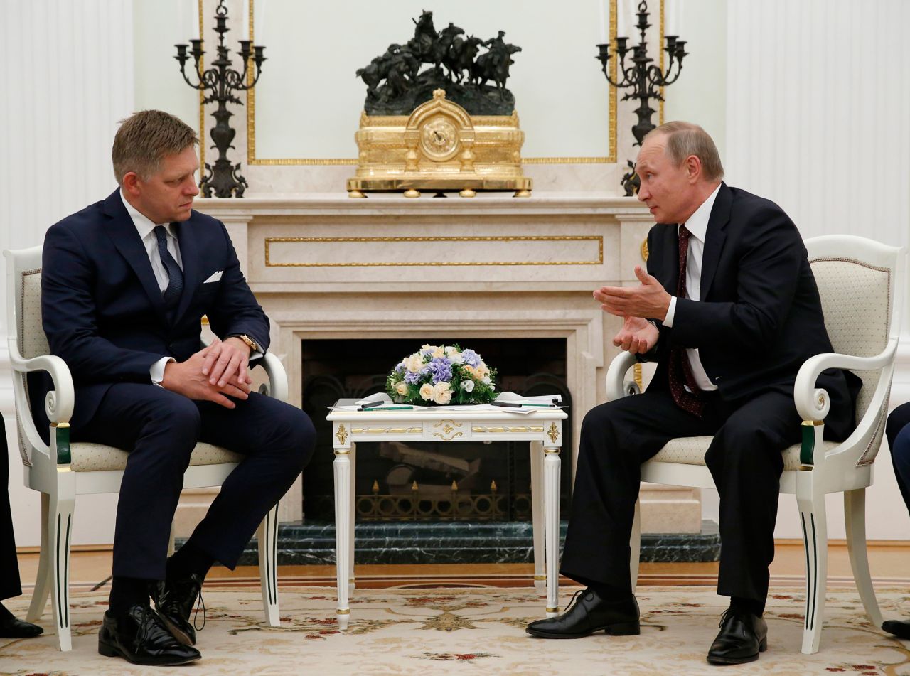 Russian President Vladimir Putin, right, speaks to Slovak Prime Minister Robert Fico during a meeting in Moscow, in August 2016.