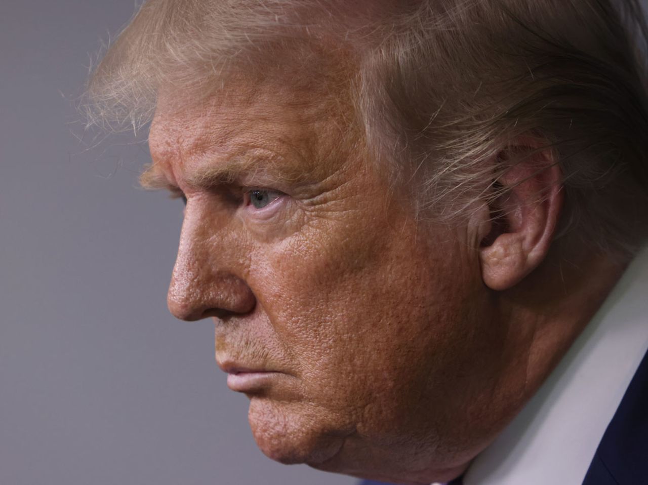 Former US President Donald Trump listens to a question during a news conference in the James Brady Press Briefing Room of the White House on August 5, 2020 in Washington, DC.