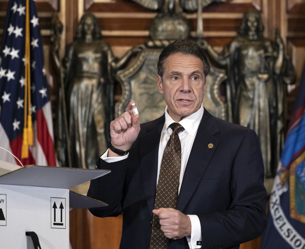 Gov. Andrew M. Cuomo, Cuomo holds up samples of empty packaging for the COVID-19 vaccine during a news conference at the State Capitol in Albany, New York, on Thursday, December 3. 