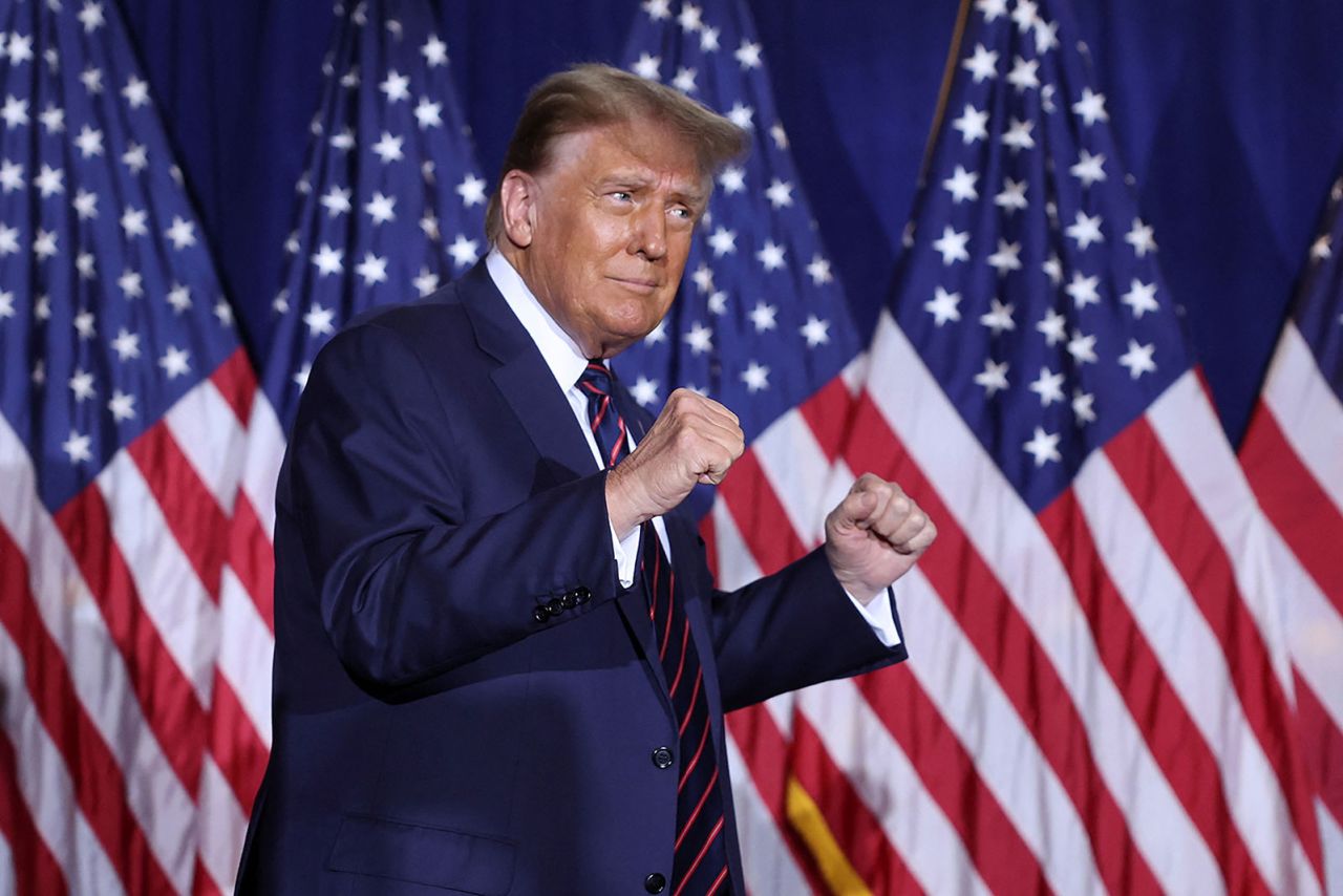 Republican presidential candidate and former US.President Donald Trump gestures as he takes the stage during his New Hampshire presidential primary election night watch party, in Nashua, New Hampshire, on Tuesday, January 23. 