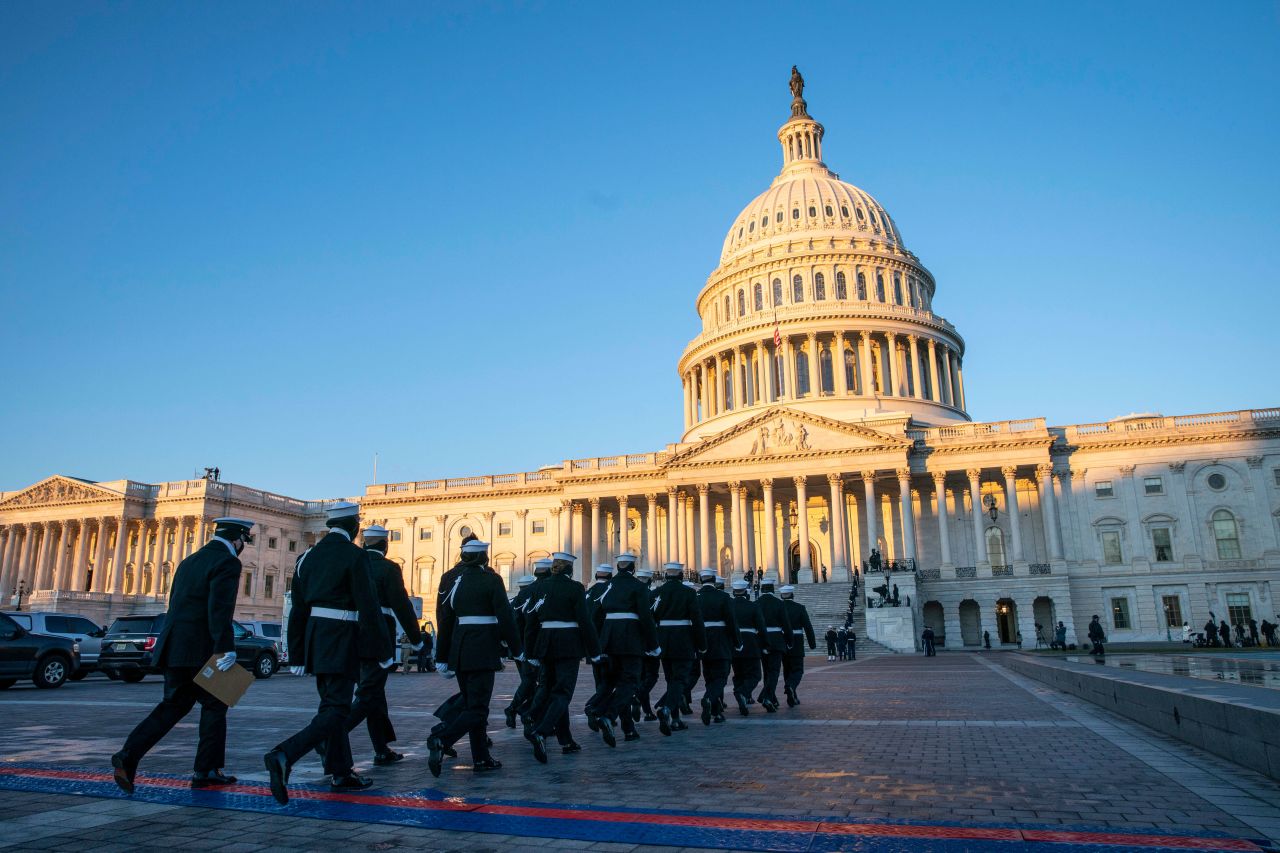 Members of the honor guard practice at sunrise for a presentation at Joe Biden’s inauguration in Washington, DC, on January 20.