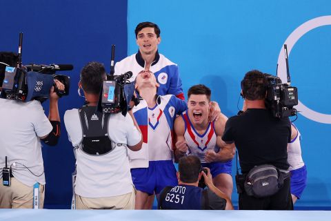 The Russian Olympic Committee celebrates after winning gold during the Men's Team Final on July 26.