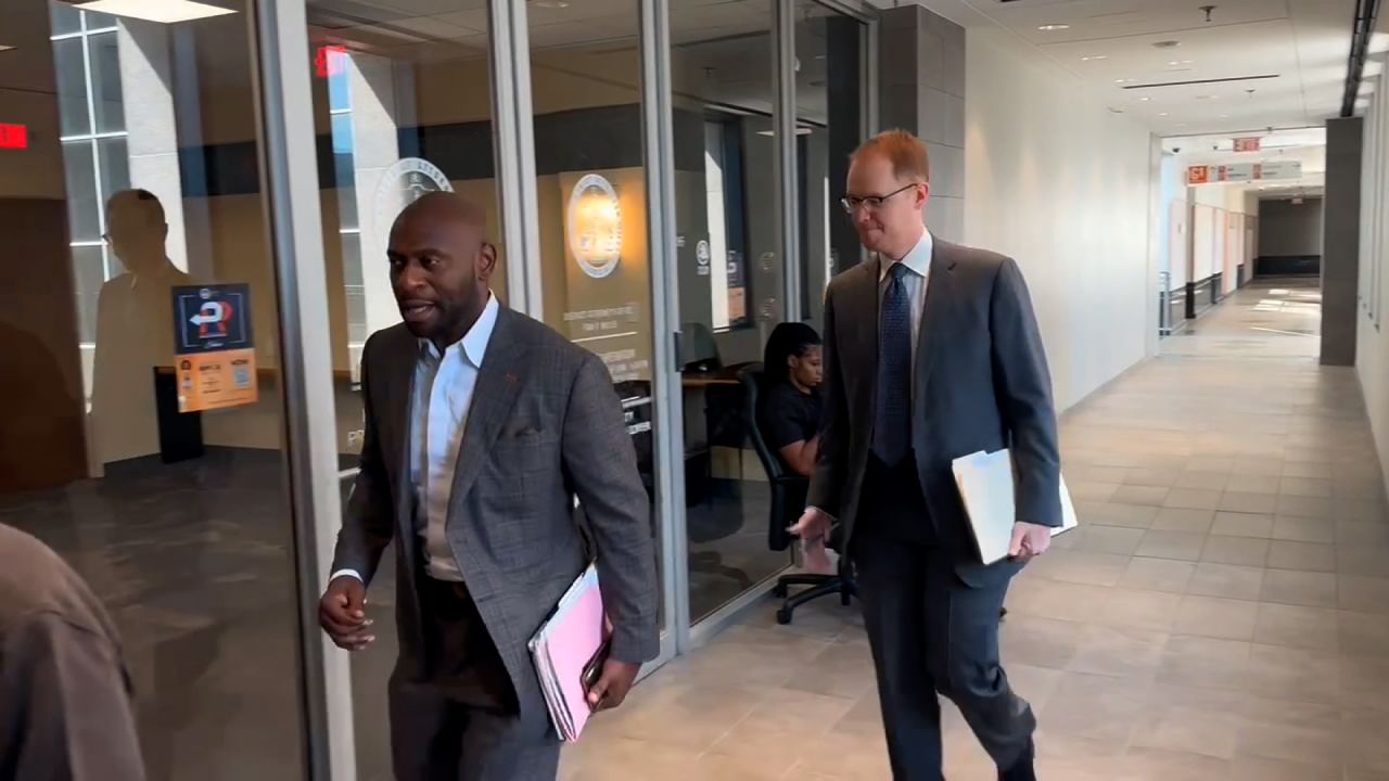 Fulton County Special Prosecutor Nathan Wade and another prosecutor arrive at the Fulton County Government Center on Tuesday. 