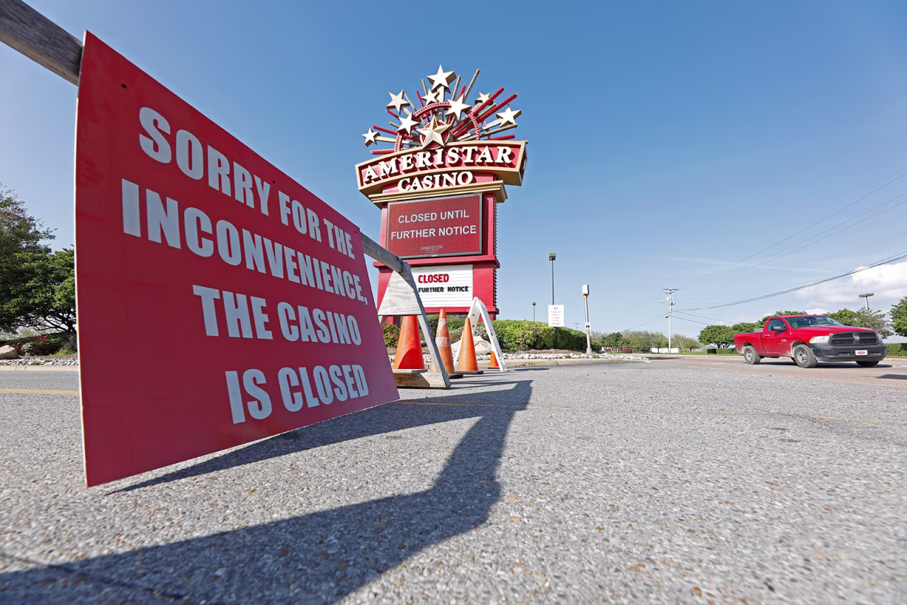 A sign announcing closures is seen outside the closed Ameristar Casino in Vicksburg, Mississippi, on Tuesday, March 17.