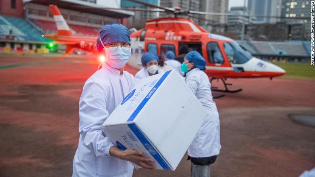 Medical staff carry supplies from a helicopter in Wuhan, China, on February 1, 2020.