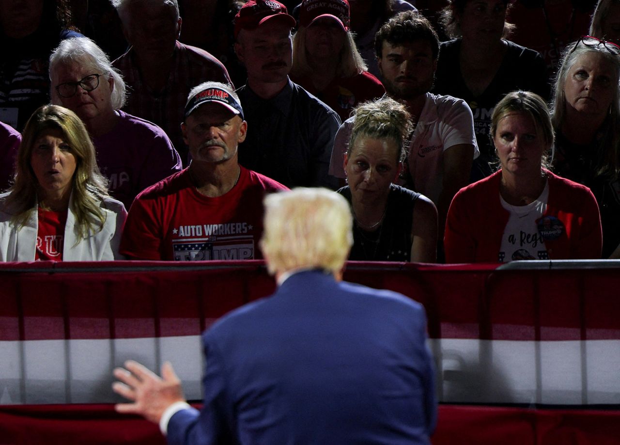 Supporters listen as Republican presidential nominee, former President Donald Trump speaks during a campaign town hall meeting, in Flint, Michigan, on September 17. 