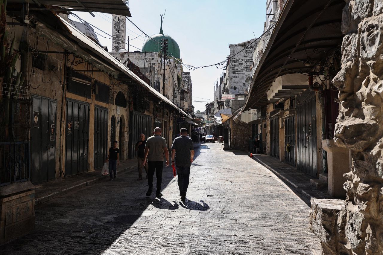 Palestinians walk through a deserted commercial area in Nablus, West Bank, during a general strike on July 31, following the assassination of Hamas political leader Ismail Haniyeh in Iran overnight.