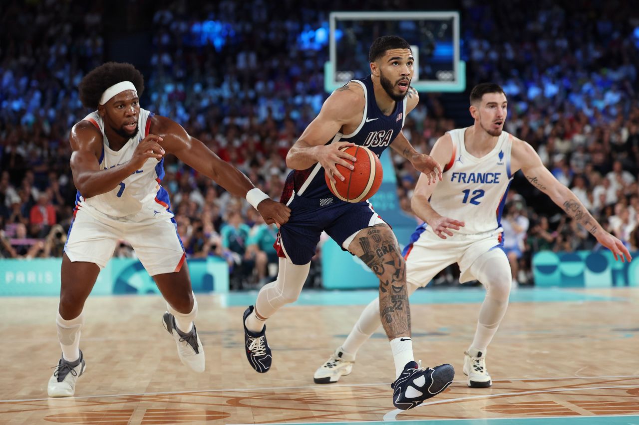 Team USA’s Jayson Tatum drives past Guerschon Yabusele and Nando de Colo of France. 