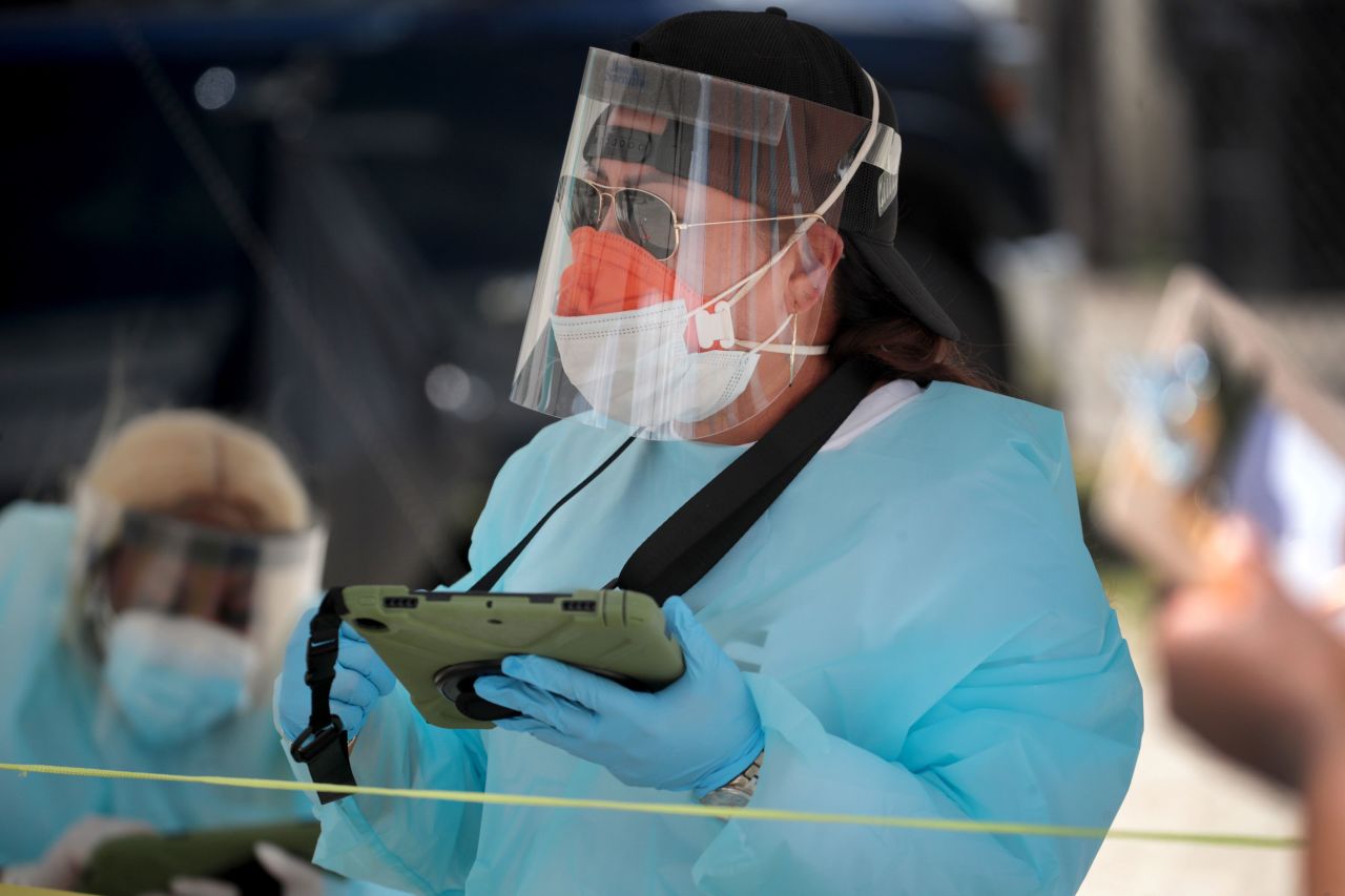 Workers check in residents at a mobile Covid-19 testing site set up in the Austin neighborhood of Chicago, Illinois, on June 23.