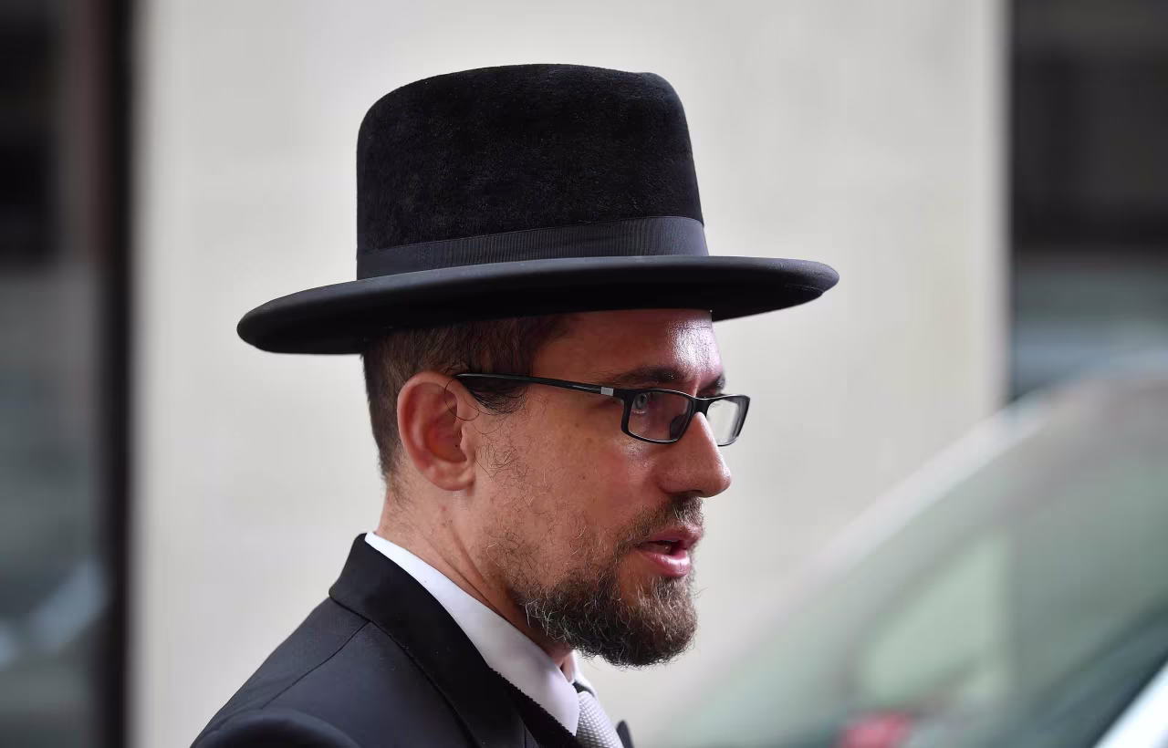 Rabbi Schlomo Hofmeister speaks to the media near the scene of the attack in Vienna, on Tuesday, November 3.