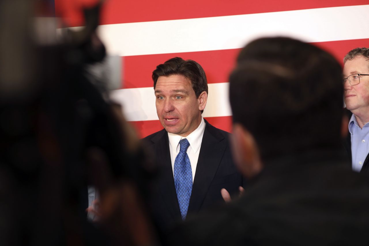 Ron DeSantis takes questions from reporters after a rally on Tuesday.