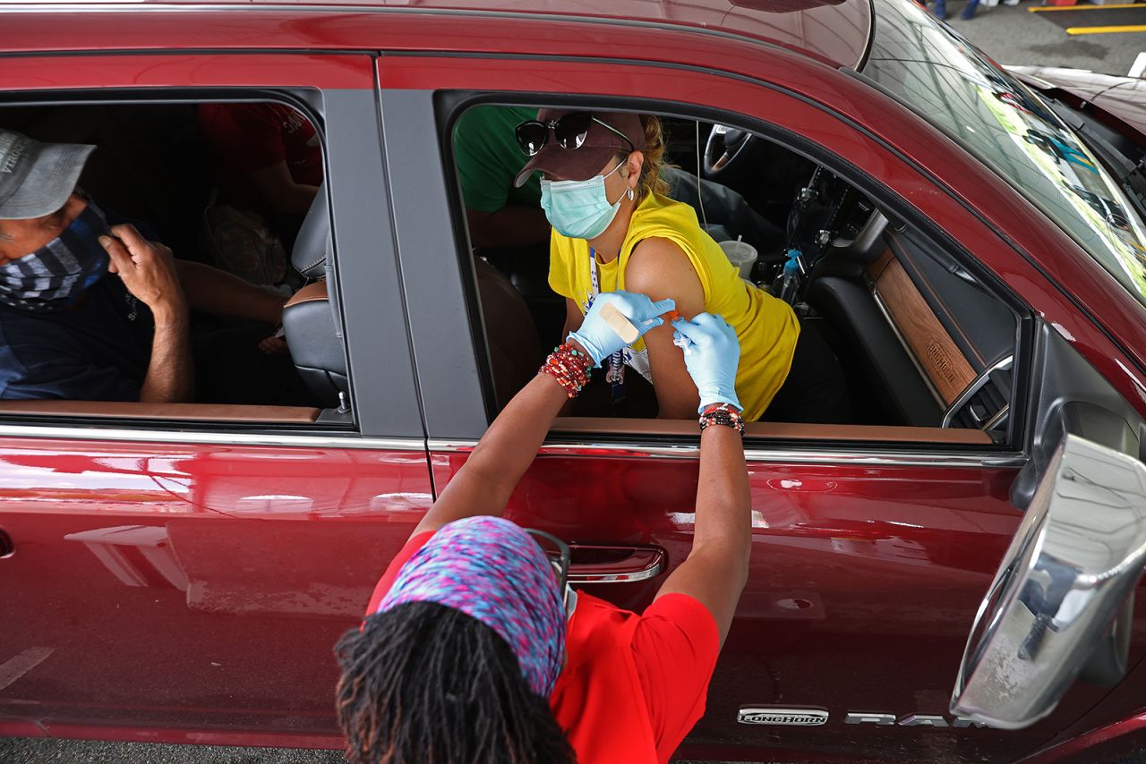 A woman receives her first dose of the Pfizer vaccine at Ripken Baseball in Aberdeen, Maryland, on May 05.