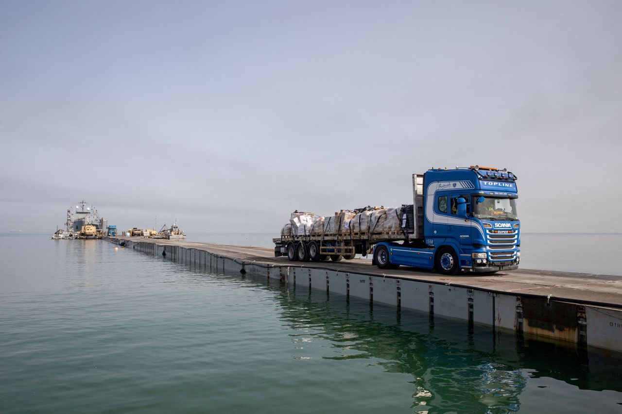 A truck carries humanitarian?aid?across Trident Pier on the?Gaza?coast, on May 19. 