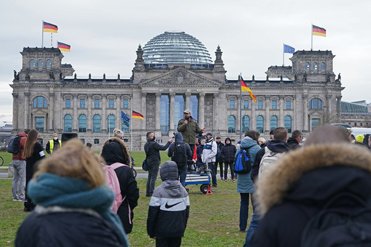 Protesters gathered outside the Reichstag on April 16, 2021 where the Bundestag was in session for the first reading of new measures to rein in the spread of the coronavirus, in Berlin, Germany.