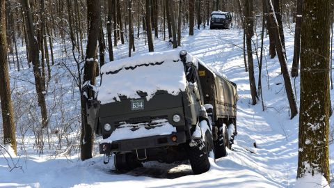A column of Russian military vehicles is seen abandoned in a forest near Kharkiv, Ukraine on March 6.