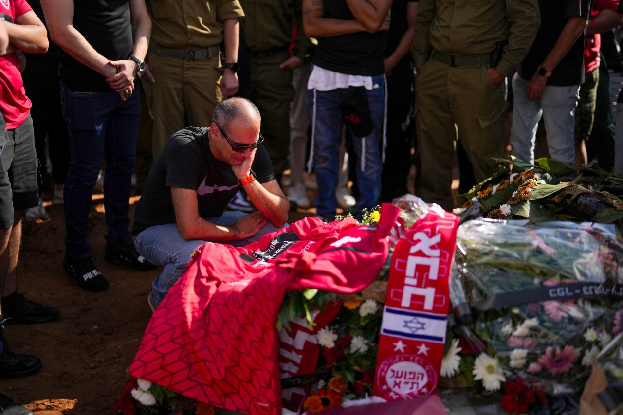 A man mourns during the funeral of Ben Fishman in Kfar Saba, near Tel Aviv, Israel, on Sunday, October 15. 