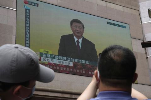 A TV screen shows the live broadcast of China's President Xi Jinping giving a speech following a swearing-in ceremony to inaugurate the city's new leader and government in Hong Kong on Friday July 1.