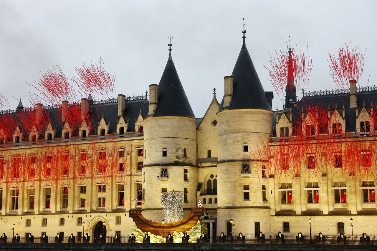 Performers are pictured by the river Seine during the floating parade in the opening ceremony. 