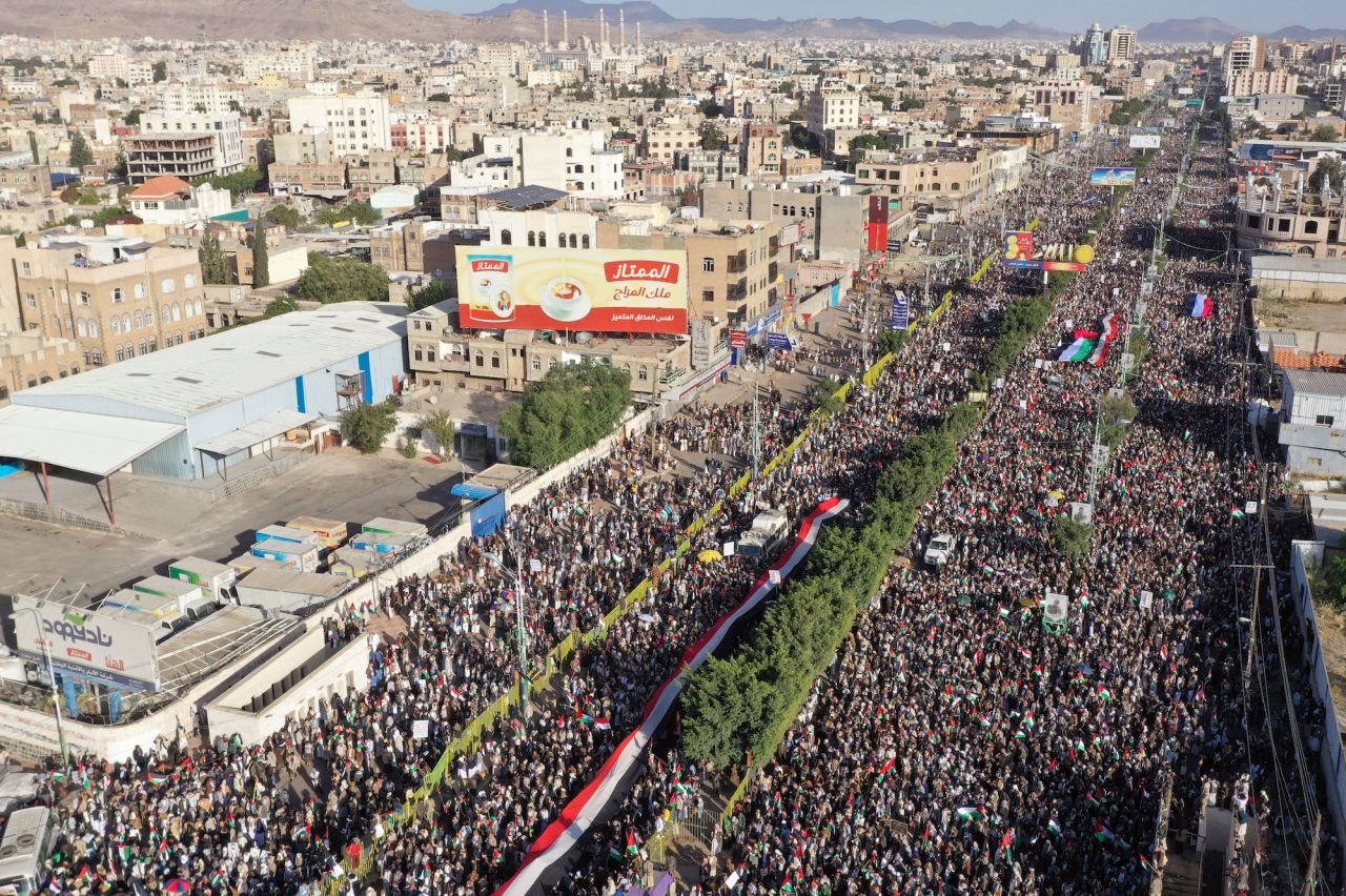 An aerial view of people holding banners and flags during a pro-Palestinian protest on Friday.