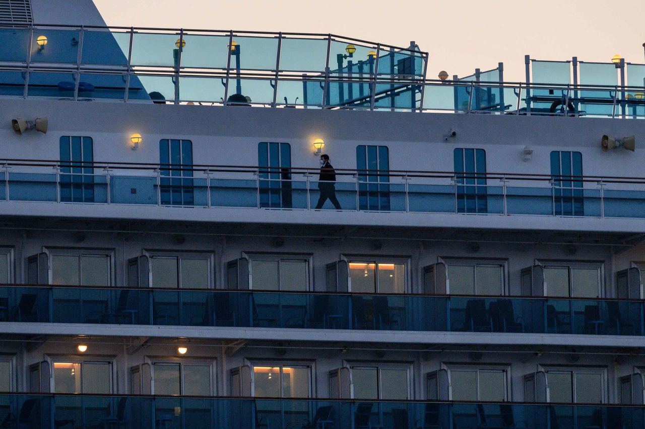 A crew member is seen aboard the quarantined Diamond Princess cruise ship at Daikoku pier cruise terminal in Yokohama, Japan on February 24.