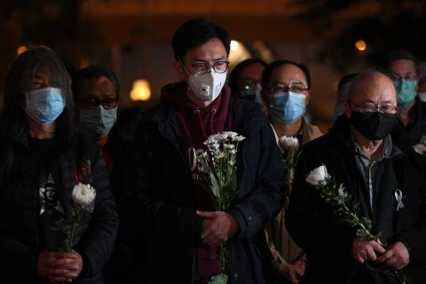 People attend a vigil for Doctor Li Wenliang in Hong Kong on Friday.