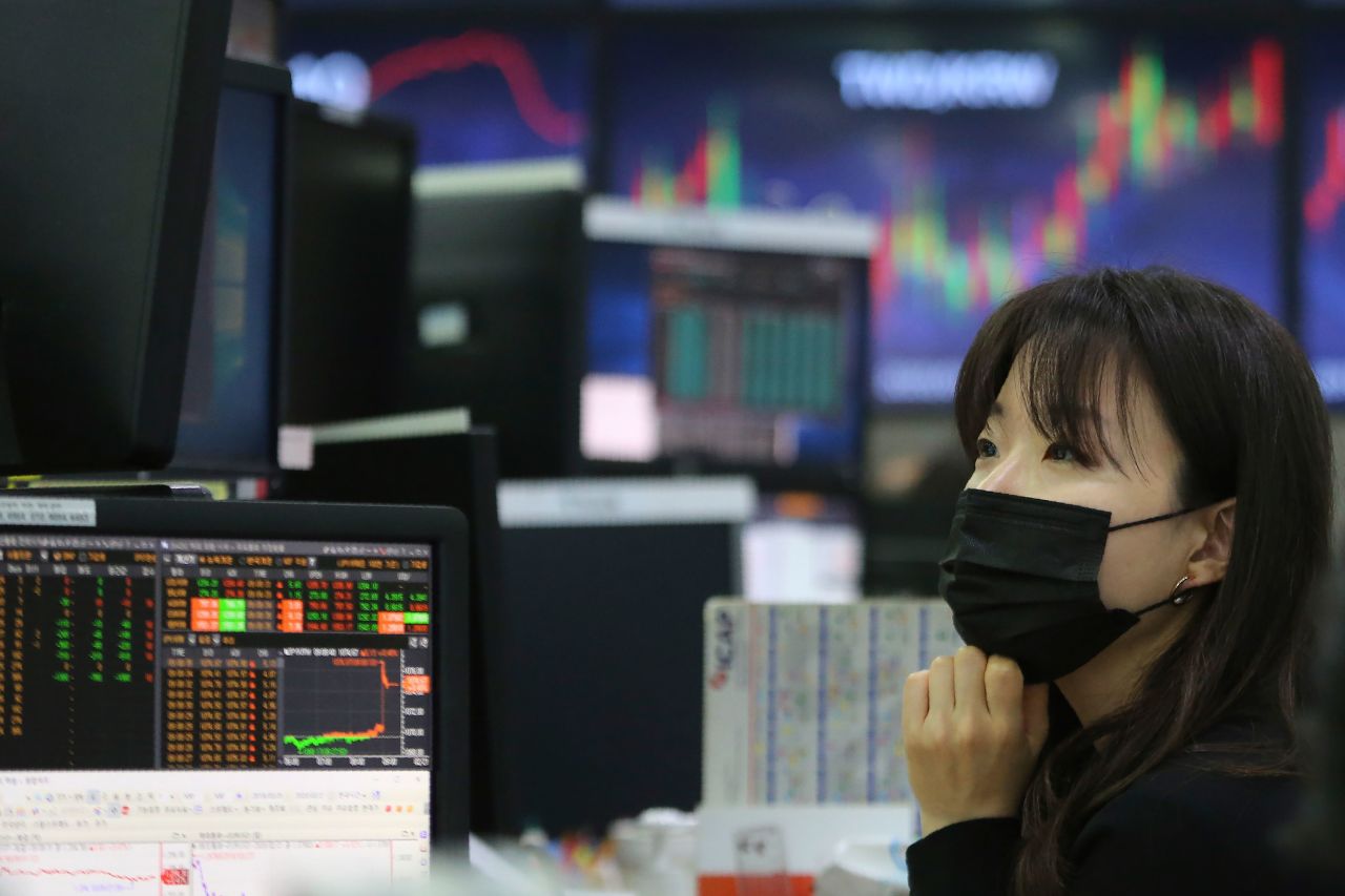 A currency trader monitors at the foreign exchange dealing room of the KEB Hana Bank headquarters in Seoul on February 21.