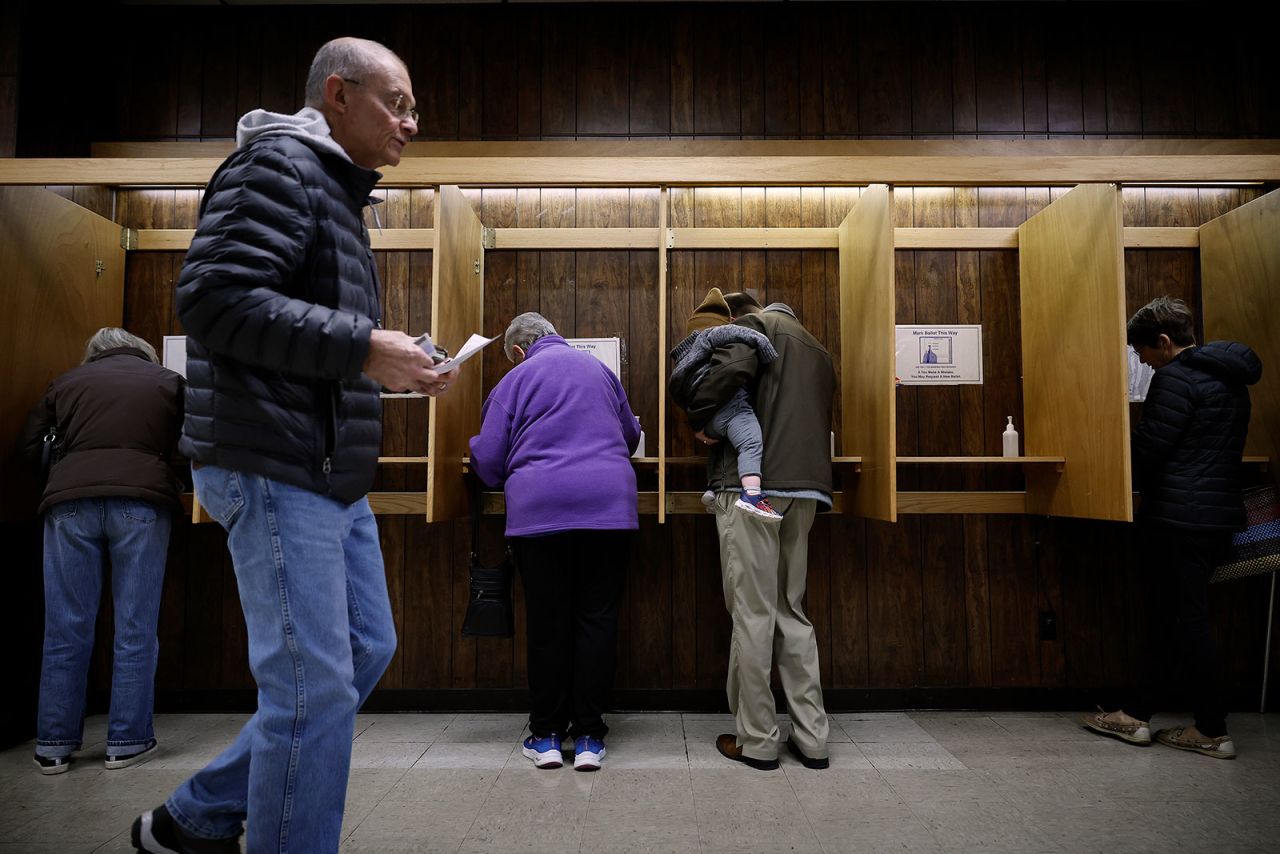 Voters fill out their ballots before casting their votes on November 8, in Oshkosh, Wisconsin.