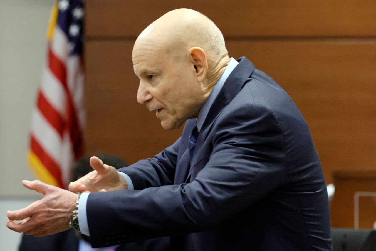 Assistant State Attorney Mike Satz gestures as if he is holding a rifle while giving his closing argument in the penalty phase on Tuesday.