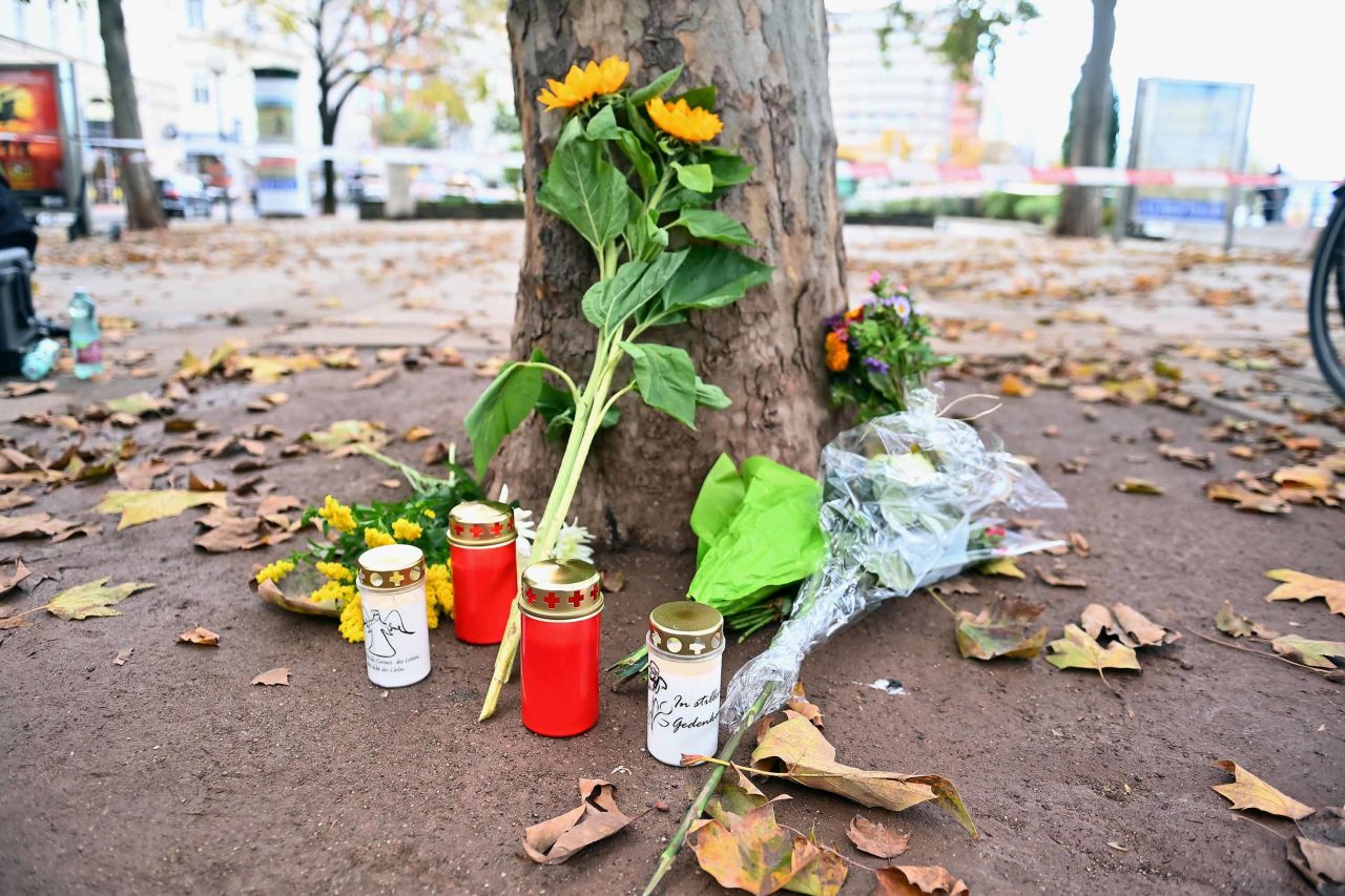 Flowers and candles are left for the victims of the attack at Schwedenplatz in Vienna, on Tuesday.