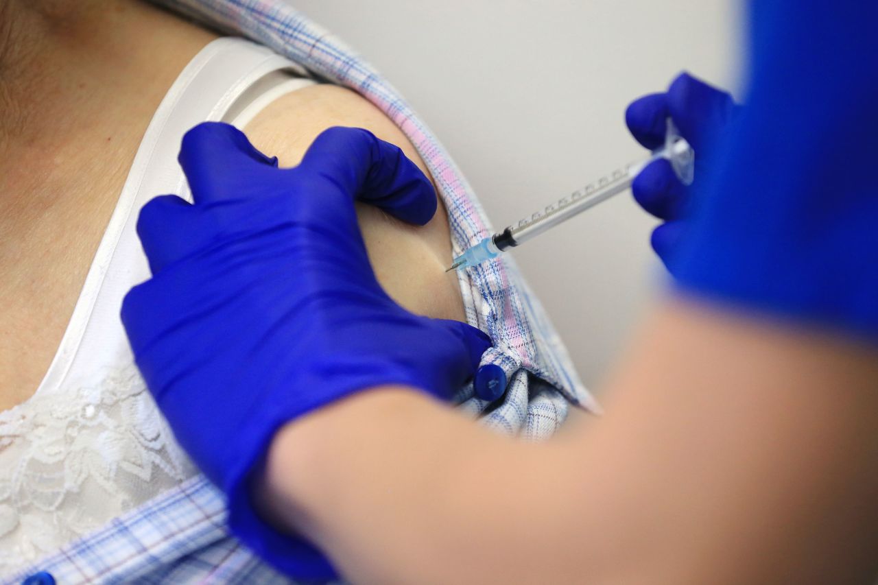 A nurse administers a dose of the Pfizer-BioNTech Covid-19 vaccine to a patient in Haxby, England, on December 22.