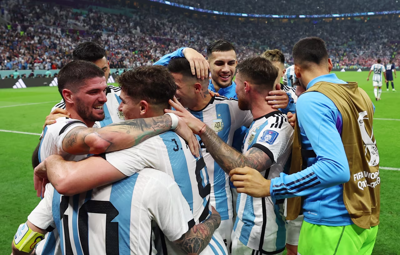 Julián Álvarez celebrates scoring Argentina's third goal with teammates at Lusail Stadium in Lusail City, Qatar on Tuesday.