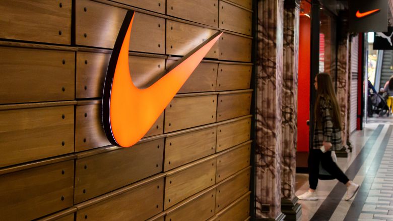 A woman walks into a Nike store in a shopping mall in Moscow, Russia, on May 30.