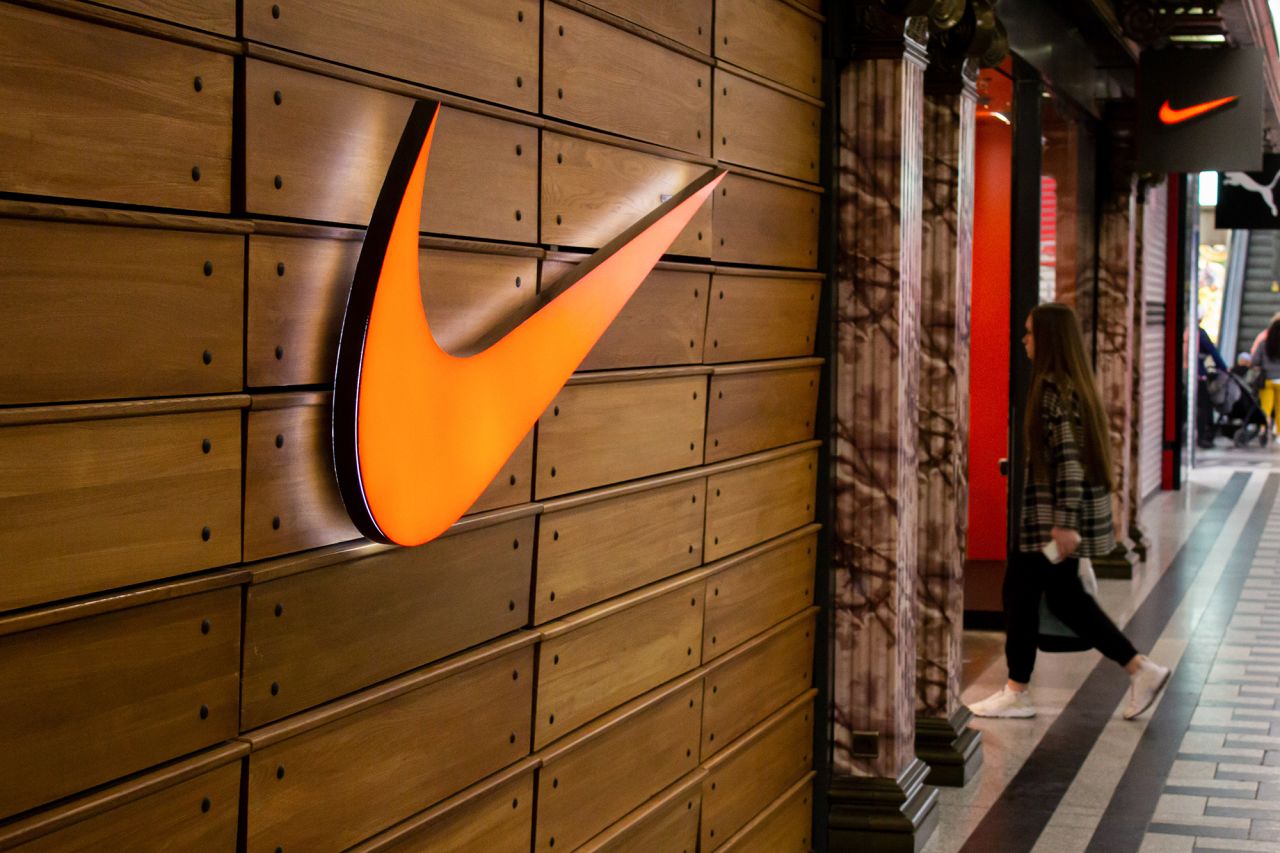 A woman walks into a Nike store in a shopping mall in Moscow, Russia, on May 30.