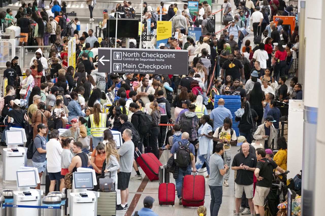 Passengers navigate Hartsfield-Jackson Atlanta International Airport on July 19.