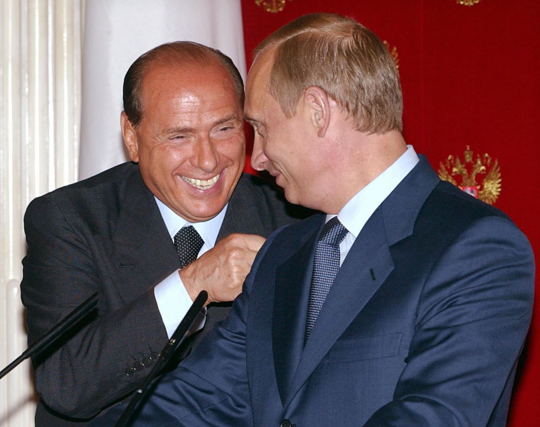 Then-Italian Prime Minister Silvio Berlusconi smiles with Russian President Vladimir Putin during a joint press conference at the Kremlin in Moscow, in 2003.