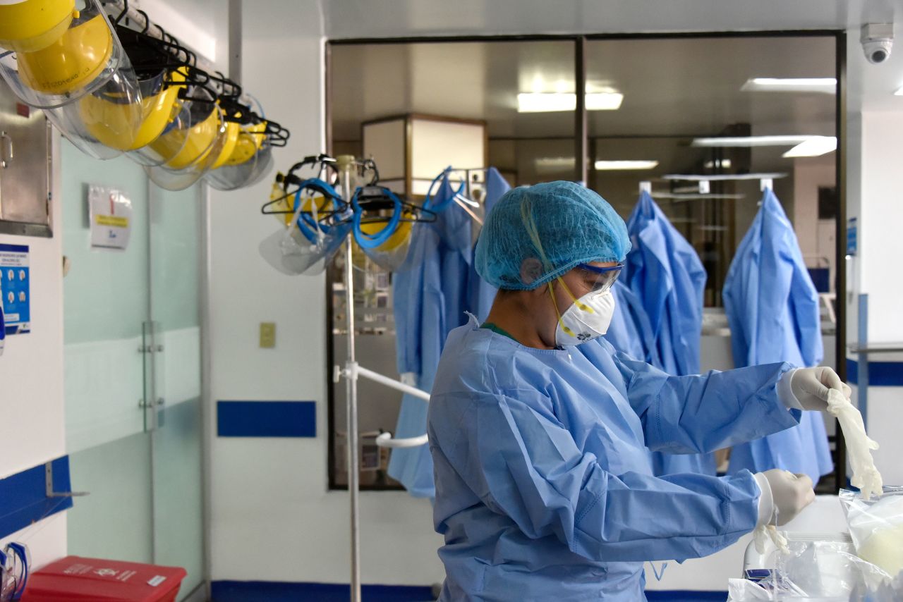 A health worker prepares to treat a patient with Covid-19 on August 28 in Bogota, Colombia. 