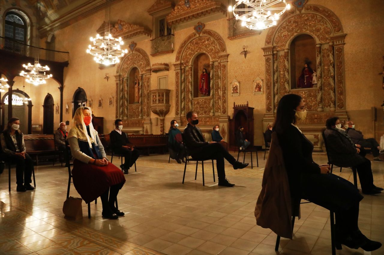 People attend a mass at the Nossa Senhora das Dores Church in Porto Alegre, in southern Brazil, after the city eased measures taken to curb the spread of the coronavirus pandemic on May 29.