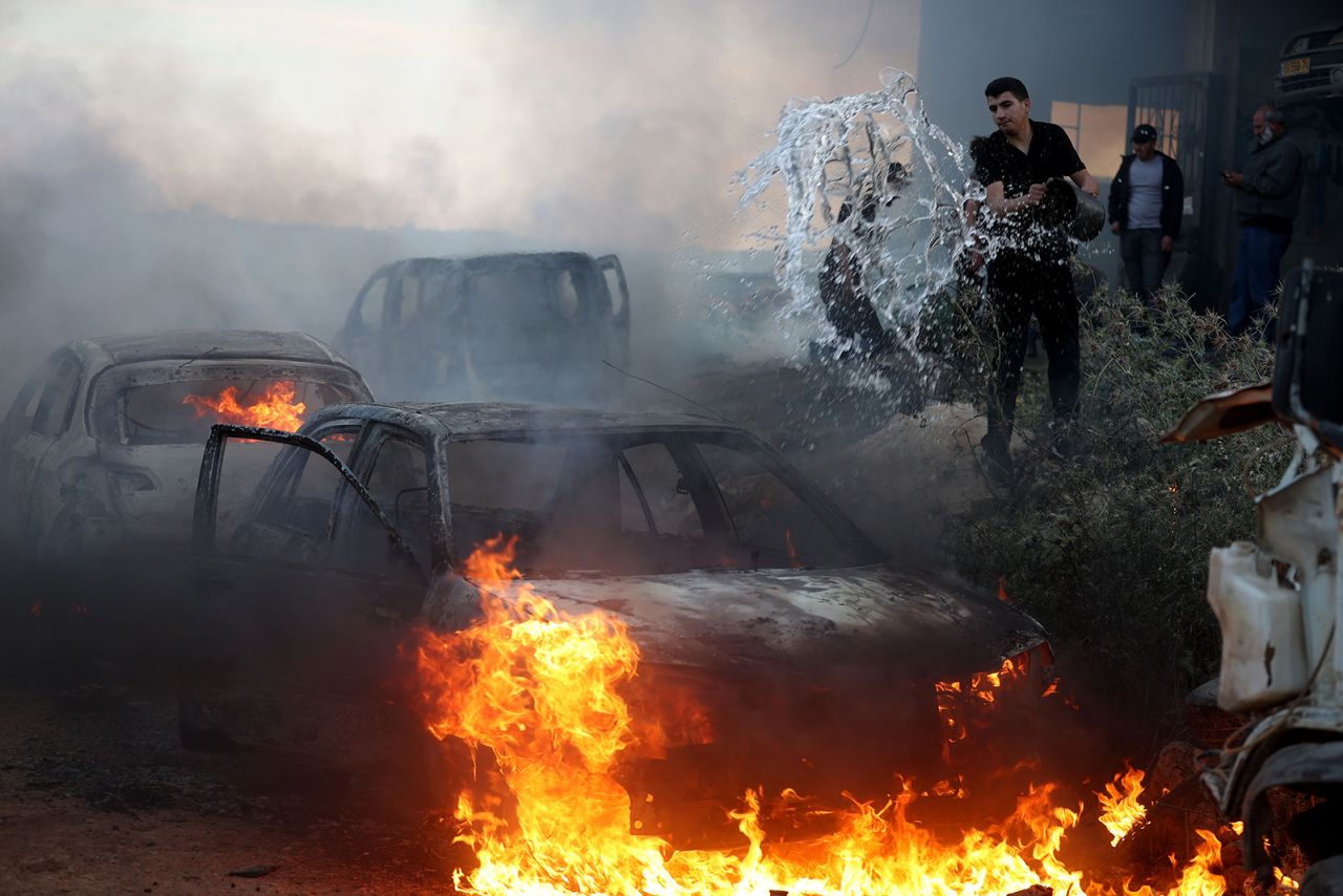 A view of damaged houses and burning vehicles after a raid by Jewish settlers on the Mughir town near Ramallah, West Bank on April 12.