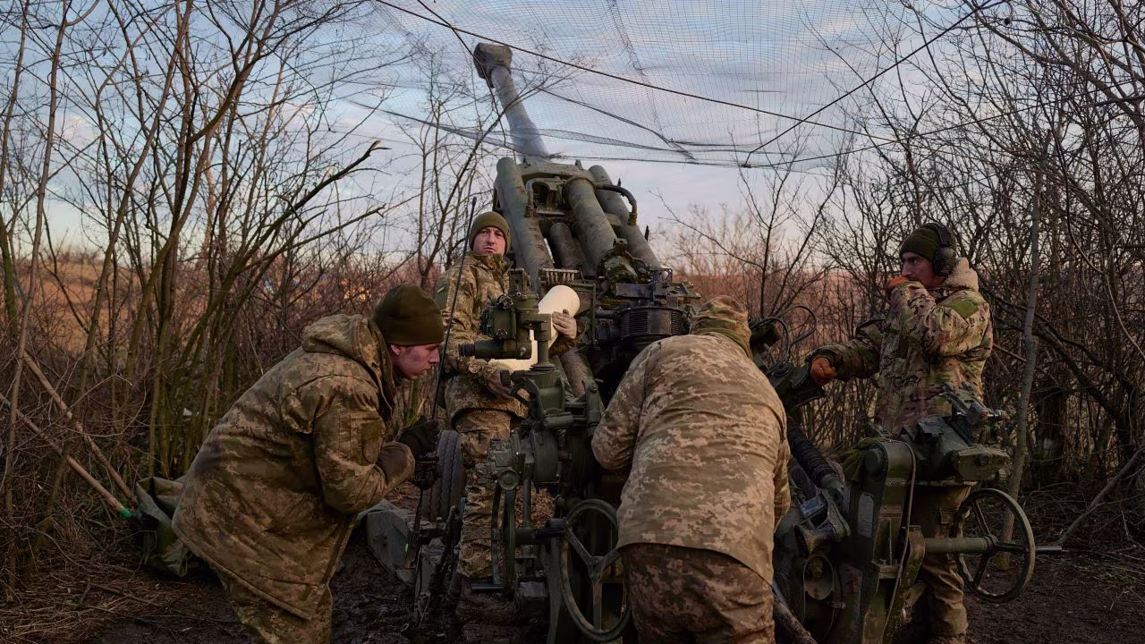 In this December 2022 photo, a Ukrainian artillery brigade operates a US-made Howitzer M777 cannon in the eastern Ukrainian town of Bakhmut.