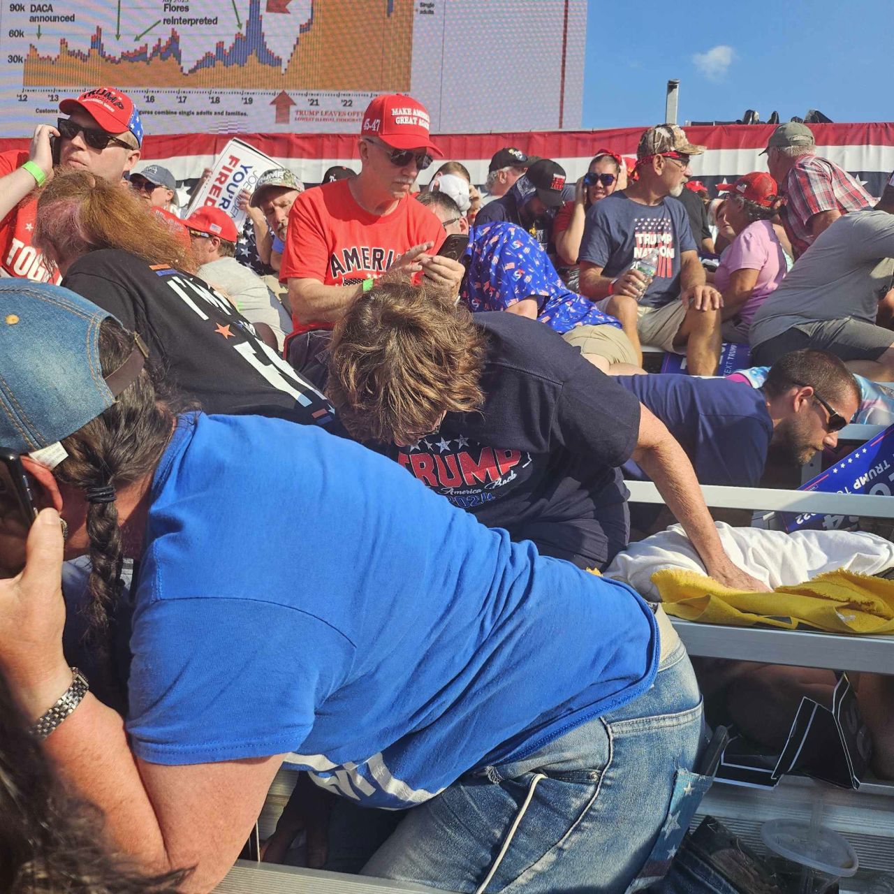 Attendees duck for safety at former President Donald Trump’s rally in Butler, Pennsylvania, on July 13. 