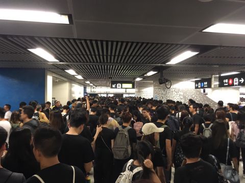 Protesters queue for the eastbound Island Line at Admiralty station in Hong Kong