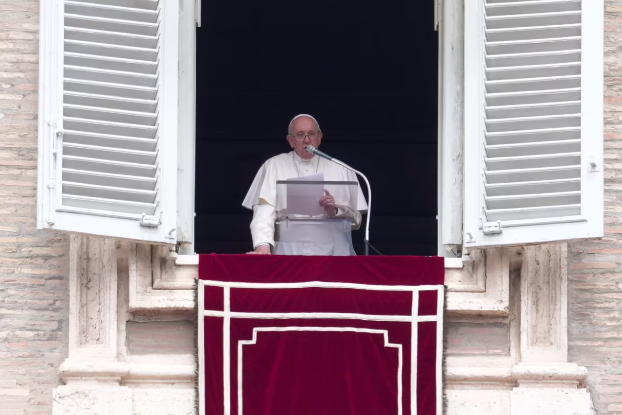 Pope Francis delivers his message from his studio window overlooking St. Peter's Square during the Regina Coeli prayer at the Vatican, on Sunday, May 1.