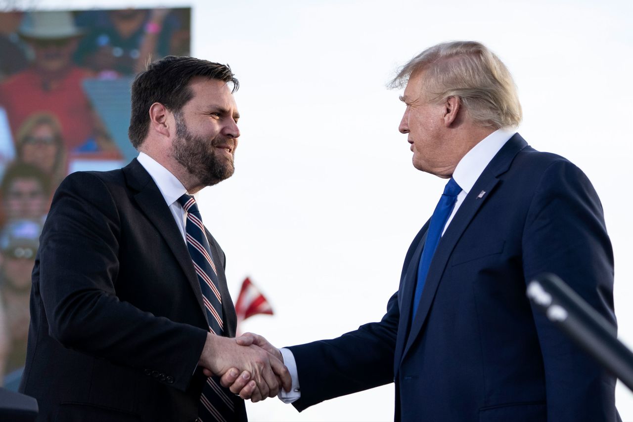 J.D. Vance shakes hands with former President Donald Trump during a rally hosted by the former president at the Delaware County Fairgrounds on April 23, 2022 in Delaware, Ohio.