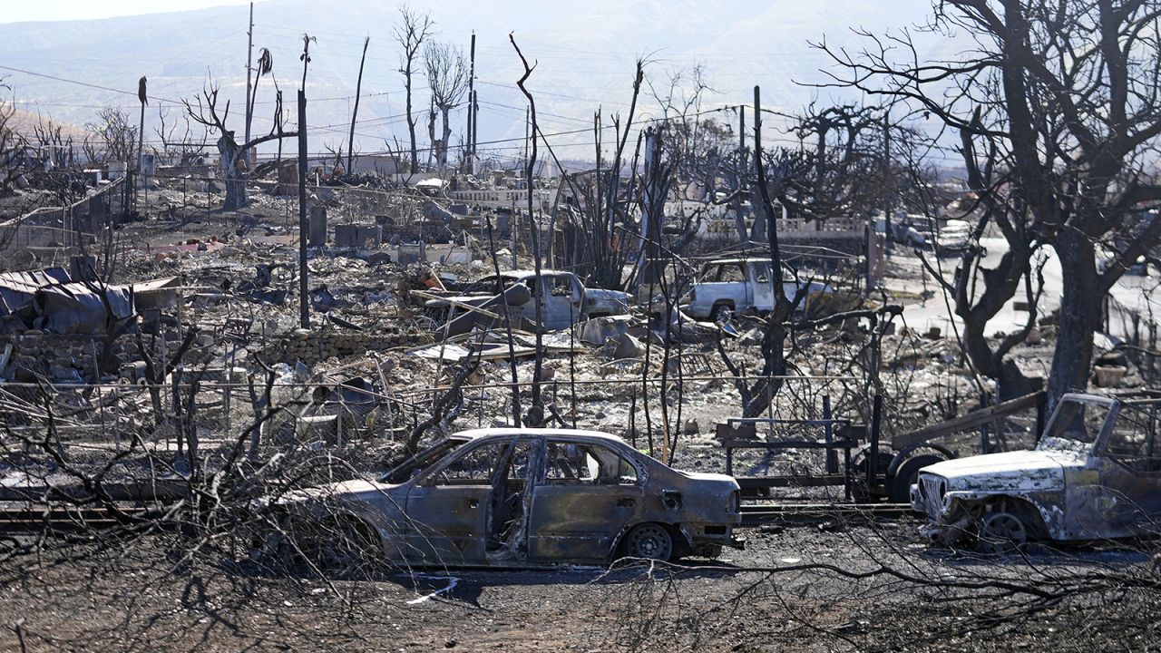 Destroyed homes and cars are shown, Sunday, August 13, 2023, in Lahaina, Hawaii.