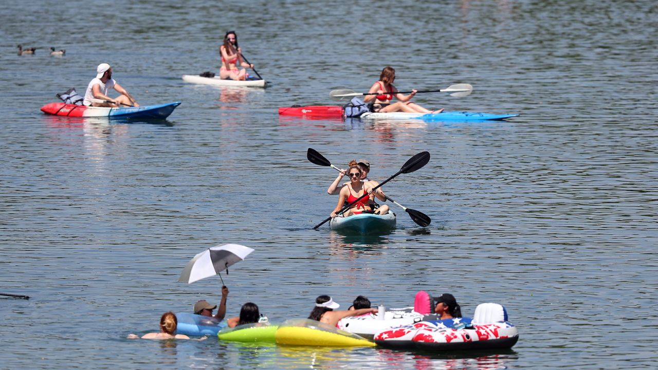 Residents swim, paddle board and kayak in Barton Creek in Austin, Texas on May 20.