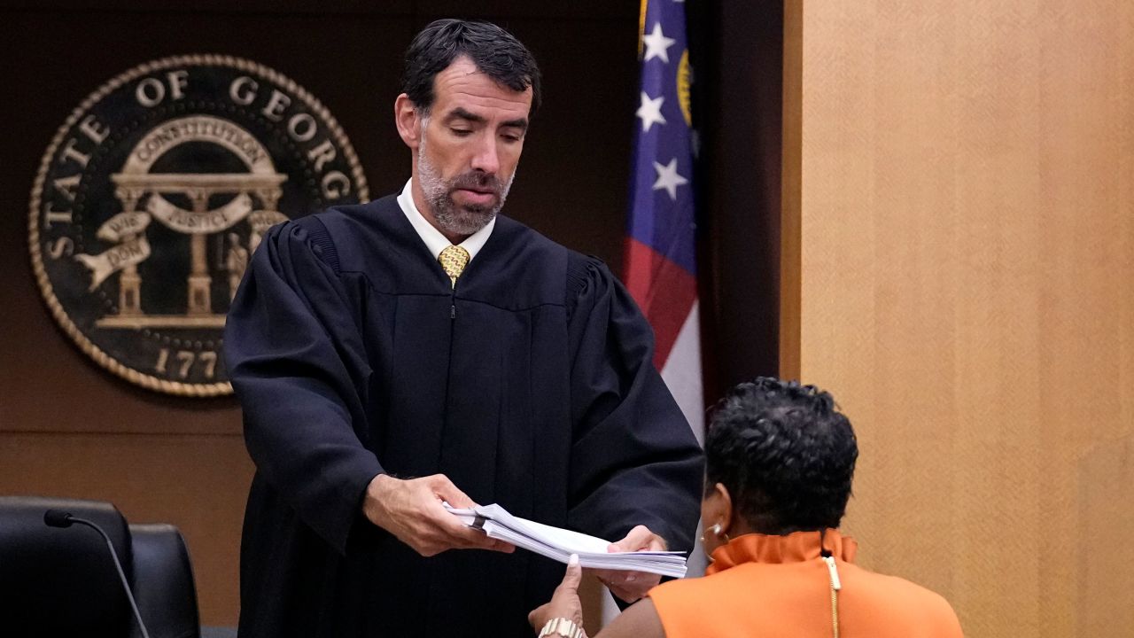 County Clerk Che Alexander, right, speaks with Fulton County Superior Court Judge Robert McBurney, Monday, Aug. 14, 2023, in Atlanta.