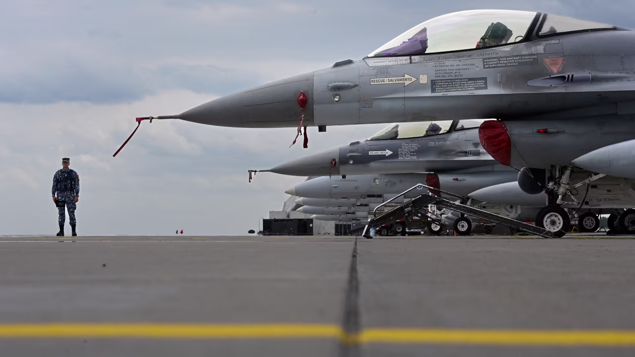 Portugese Air Force and Romanian Air Force F-16 jets sit on the tarmac of Siauliai airport in Lithuania during the NATO exercise as part of the NATO Air Policing mission on July 4.