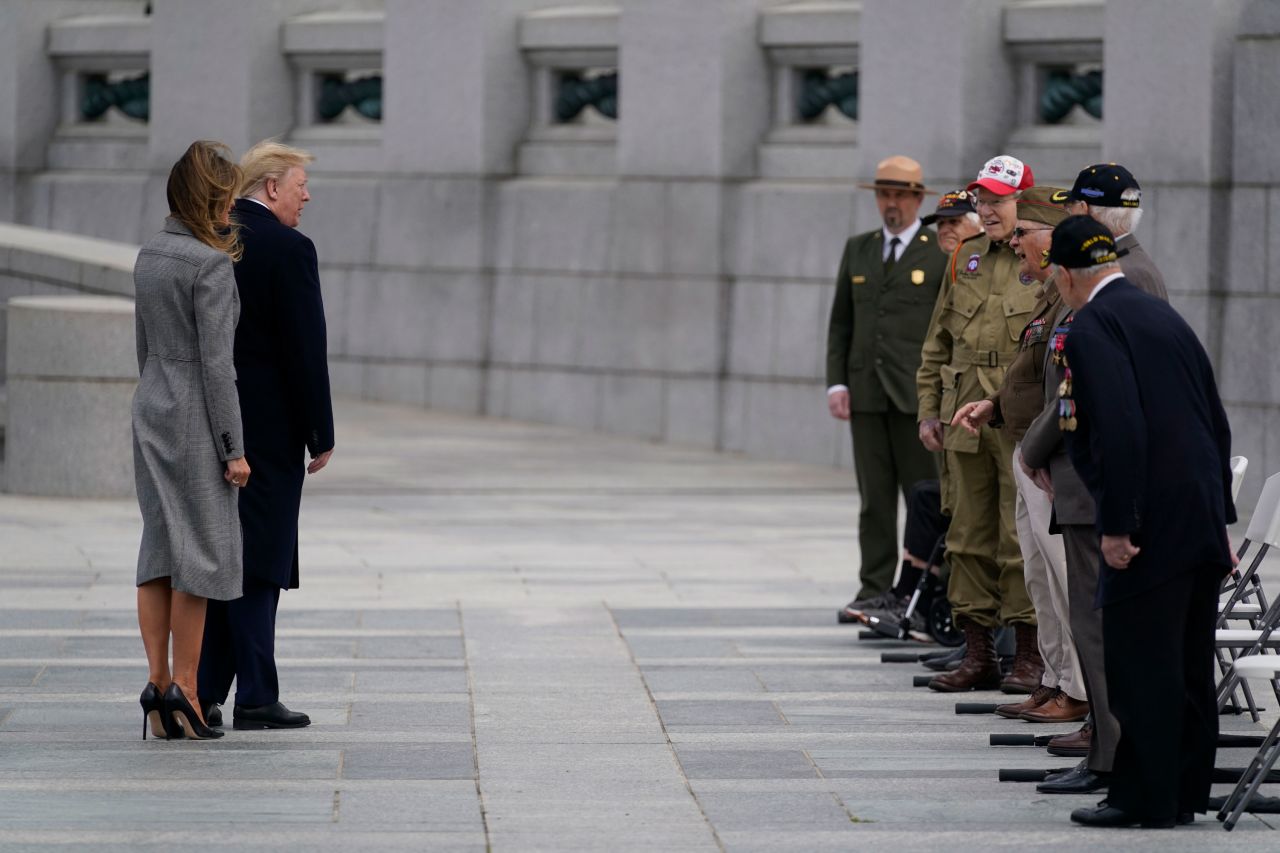 President Donald Trump and first lady Melania Trump greet veterans during a ceremony at the World War II Memorial to commemorate the 75th anniversary of Victory in Europe Day, on May 8, in Washington. 